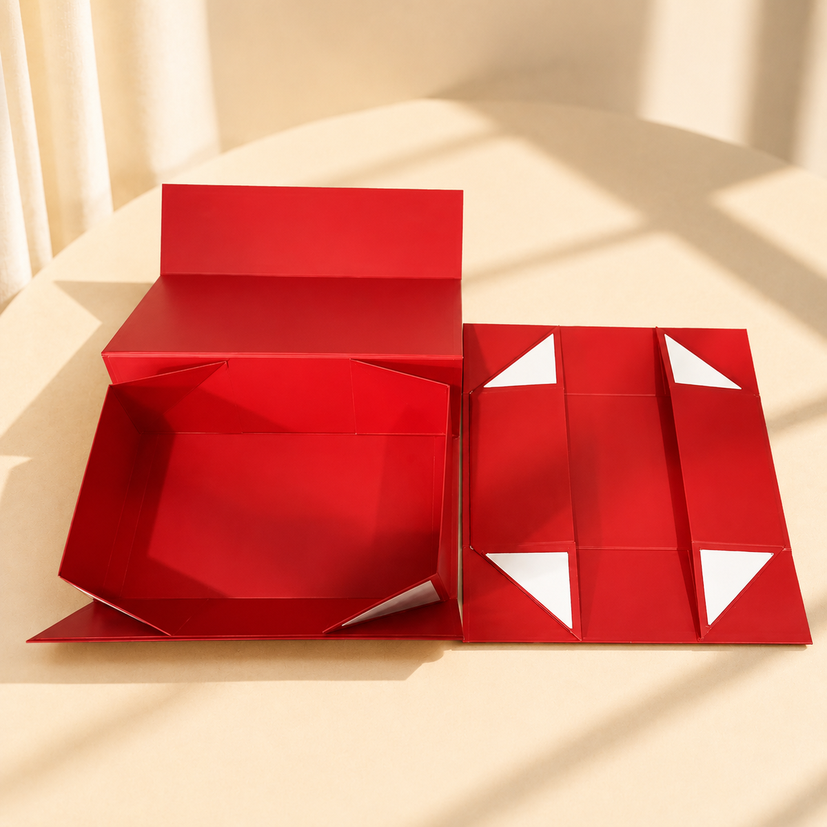 Red collapsible magnetic gift box shown open and flat