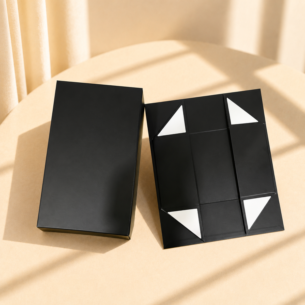 Black foldable rigid gift box shown assembled and flat