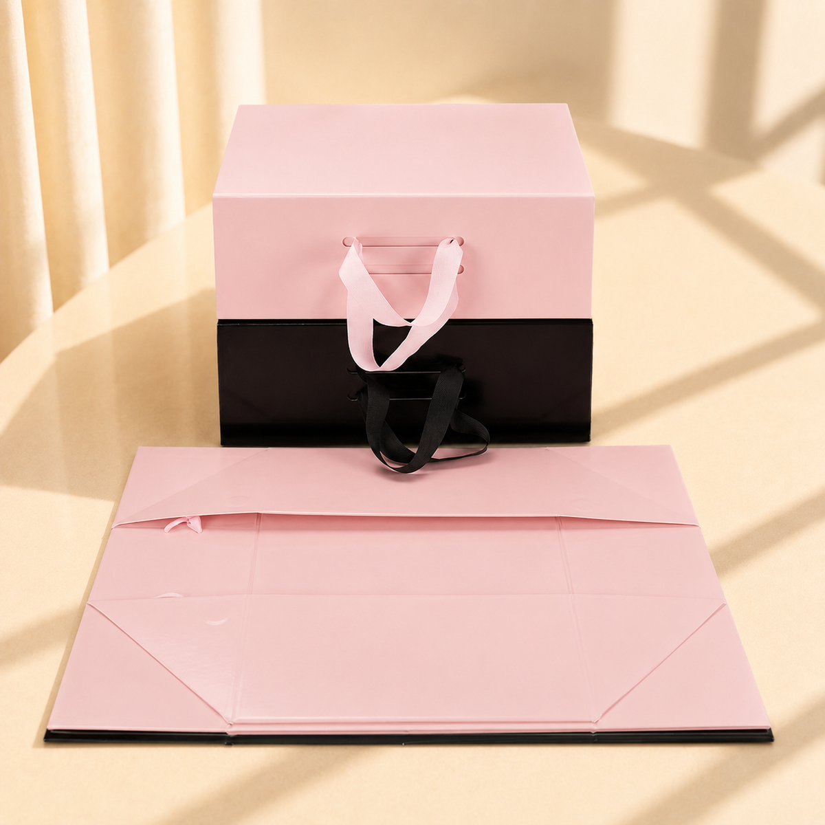 Pink and black handled folding gift boxes with matching flat panels